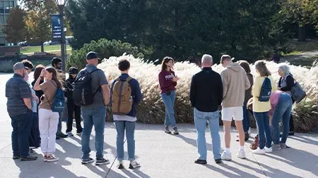 Group of students and families touring campus